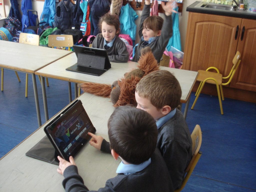 Junior Infants working on the tablets